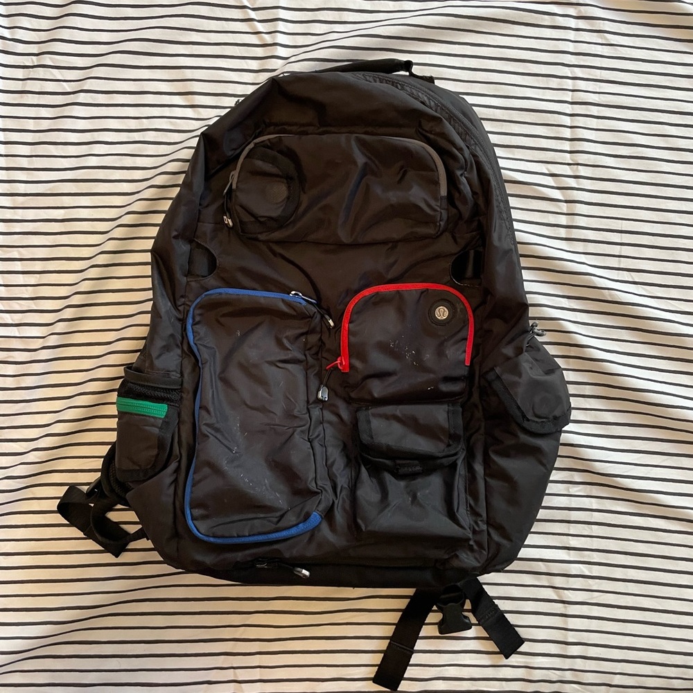 Lululemon backpack with laptop insert and yoga mat carrier.